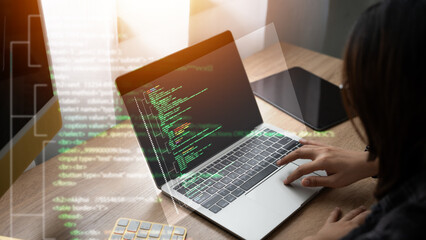 Wall Mural - coding computer programmer,woman typing on laptop with green screen the screen is full of code. and 