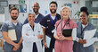 © peopleimages.com - Healthcare, smile and group with documents, hospital and diversity of staff, portrait and collaboration. Teamwork, professional and people with joy, women and men with interns, clinic and together