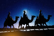 © Artur - Silhouette of the three wise men traveling on camels to Bethlehem for the birth of baby Jesus