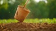 © Nisit - Shovel Lifting Soil from Pot in Garden with Soft Focus on Background, Capturing the Essence of Gardening and Nature in an Idyllic Setting