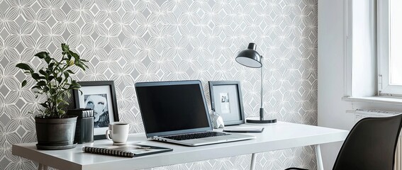 Wall Mural - a modern home office desk with a laptop and coffee cup on a white table against a wall decorated with a geometric pattern wallpaper