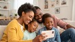 © jabireffacts - Portrait of african american family taking a selfie together at home