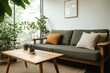 © Analogue - Cozy Living Room with Green Sofa and Wooden Coffee Table Surrounded by Plants in a Bright, Naturally Lit Space with a Minimalist Aesthetic