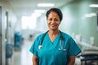© NikoG - Smiling portrait of a middle aged female Indian nurse in hospital