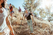 © Marko Geber - Group of friends hiking on a steep trail in the forest