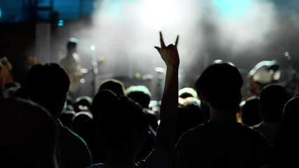 Wall Mural - People hands making rock gesture at the concert, slow motion video