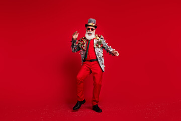 Wall Mural - Full size photo of happy cheerful old man dancing good mood wear christmas tree balls costume sunglasses isolated red color background