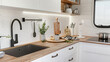 © neirfy - White walls, wooden countertops, a sink,