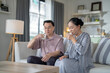 © ultramansk - An elderly couple enjoys a peaceful moment at home, sharing smiles and drinks. The warm and cozy atmosphere emphasizes their deep connection, happiness, and the comfort of spending time together.