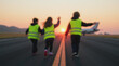 © Dmytriy - Blurred image of a runway, airplane in the background, children in reflective vests playing at sunset