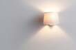 © justjupiter - Home sweet home, A modern wall lamp casts a soft glow, illuminating a plain wall with a cozy ambiance.
