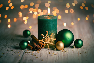 Wall Mural - green christmas candle on 1 . advent with classic natural xmas decoration with balls and cinnamon st
