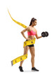 © Ljupco Smokovski - Female exercising with a dumbbell with a measure tape arounf body
