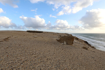 sand and stones on the coast of the peninsula overlooking the sea