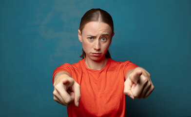 Wall Mural - pointing forward at camera with both fingers and angry expression, telling you to do your duty