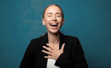 Wall Mural - looking happy, cheerful, lucky and surprised covering mouth with both hands