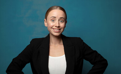 Wall Mural - smiling happily with a hands on hip and confident, proud and friendly attitude