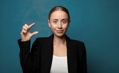 Wall Mural - holding an object ,showing, offering or advertising something small