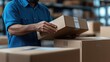© Evgenii - warehouse worker organizes and moves cardboard boxes in a logistics center, ensuring streamlined operations and efficient inventory management during the day