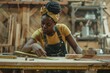 © darshika - Skilled African American woman crafts handmade furniture at home.