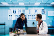 © DC Studio - Physician meeting with a patient to discuss medical test results in a cabinet, using advanced diagnostic tools to interpret x ray scans, demonstrating a professional healthcare approach.