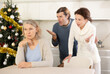 © JackF - Man and wife yell at elderly woman, prove their case in disputed property issue during winter holiday. Family conflict, abuse due to misunderstanding