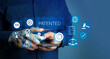 © jittawit.21 - Patented patent copyright law business technology concept. businessman touch virtual screen