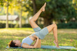 © JackF - Adult woman doing yoga asanas with blocks on mat in park