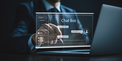 chatbot technology implementation: a businessman configures a chatbot interface on a laptop, demonst