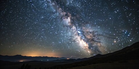 dark canvas of night sky with twinkling stars scattered across the vast expanse, creating a celestia