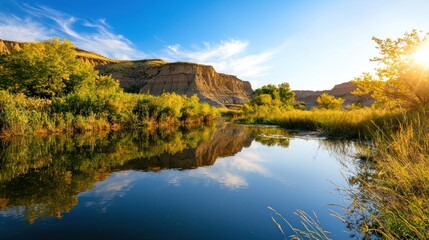 Wall Mural - a serene landscape featuring a calm river reflecting lush greenery and cliffs under a bright blue sk