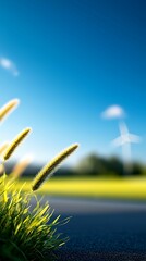 Wall Mural - International day of clean energy concept, A vibrant landscape featuring tall grass and a clear blue sky, with a distant wind turbine suggesting a blend of nature and renewable energy.