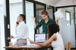 © Witoon - Meeting, collaborating and planning projects together in a modern office conference room. Teamwork, diversity and discussion.