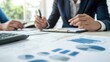 © marco - Businesspeople Analyzing Financial Data Charts and Graphs