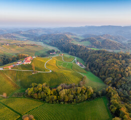 Wall Mural - aerial sunset landscape of the picturesque, autumn-covered hills near maribor, close to the austrian