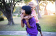 © chaunpis - Cute children play in the park at sunset.