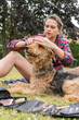 © ADDICTIVE STOCK - Grooming session with airedale terrier in a park setting