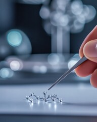 Poster - A scientist's hand carefully manipulates a molecular model in a laboratory setting during an experiment on molecular structures
