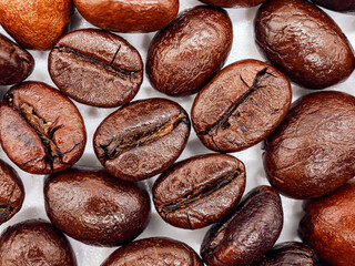 Wall Mural - Close-up of coffee beans or  macro of roasted coffee bean background, Top view