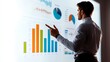 © peerawat - A business founder giving a pitch to investors, standing in front of a chart, isolated on a white background