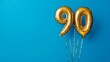 © ryanbagoez - Banner with number 90 golden balloon with copy space. thirty years anniversary celebration concept on a blue background