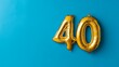 © ryanbagoez - Banner with number 40 golden balloon with copy space. thirty years anniversary celebration concept on a blue background