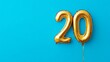 © Pangestu - Banner with number 20 golden balloon with copy space. thirty years anniversary celebration concept on a blue background