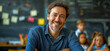 © Aquir - Teacher. Portrait of a happy handsome male teacher in the classroom