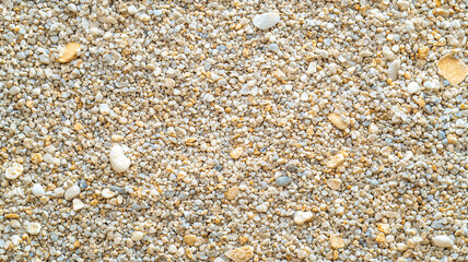 Aufkleber - top view of gravel texture with small, rounded stones in various shades of beige and white, creating natural and earthy pattern