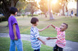 © chaunpis - group of cute asian kids having fun in the park