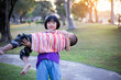 © chaunpis - Cute children play in the park at sunset.
