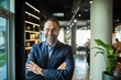 © Marko Geber - Confident senior businessman portrait smiling in modern office environment