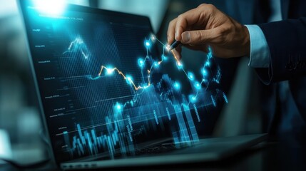 Wall Mural - a man is using a laptop to draw a graph