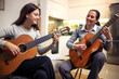 © Mediteraneo - Mother and daughter playing guitar at home. A mother teaches her daughter to play the guitar.